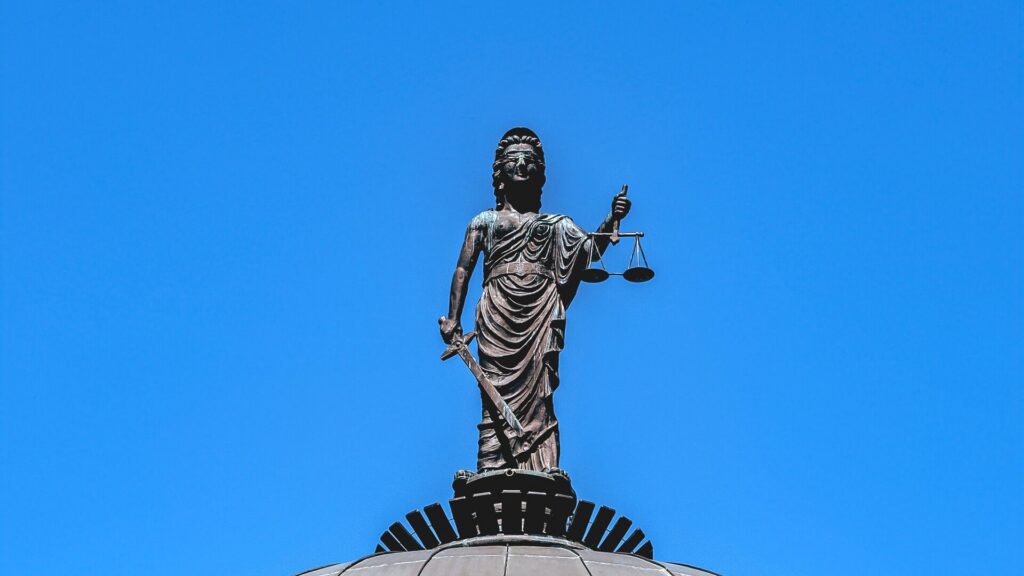 Lady Justice statue atop a courthouse dome — modification and enforcement of support and custody orders in New York